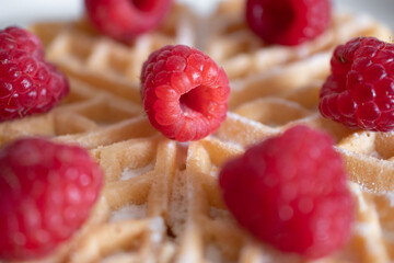 Dessert waffles with raspberries and bananas	