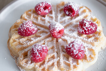 Dessert waffles with raspberries and bananas	