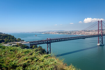 Fototapeta na wymiar Panoramic view over the 25th april bridge in Lisbon