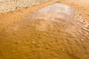 Fototapeta na wymiar Small puddle on the coast