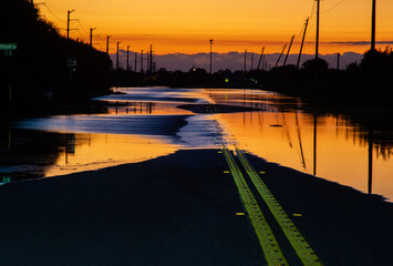 Flooded road from hurricane Ian early morning	
