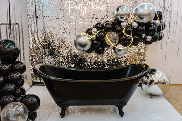 A wall with a bath for photography. A place for congratulations on birthday. Arch or photo booth...
