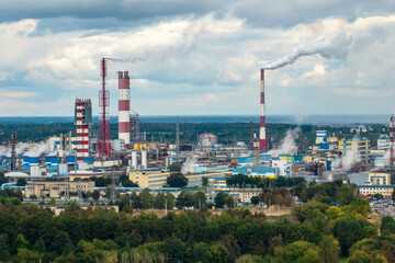 Naklejka premium aerial panoramic view on smoke of pipes of chemical enterprise plant. Industrial landscape environmental pollution waste plant. Air pollution concept.