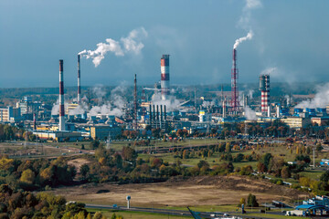 aerial panoramic view on smoke of pipes of chemical enterprise plant. Industrial landscape environmental pollution waste plant. Air pollution concept.