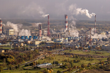aerial panoramic view on smoke of pipes of chemical enterprise plant. Industrial landscape environmental pollution waste plant. Air pollution concept.