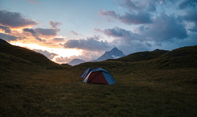 Camping Tent near Bachalpsee in the mountains of Switzerland, Night and Sunset in Swiss Alps