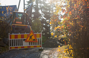 Excavator in action outdoors on an autumn day.. Construction site working concept image