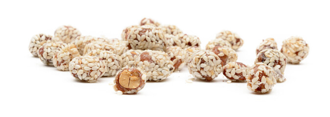 a handful of peanuts in sesame on white background