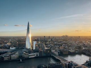 Aerial view on the Shard tower in central London with river Thames and bridge during sunset