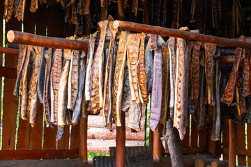 Salmon filets drying in a smoke house in Alaska