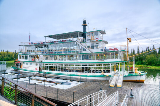 Fairbanks, Alaska - August 27, 2022: Riverboat Discovery III docked at Steamboat landing in Fairbanks, Alaska. The stern wheel boat is owned by the Binkley family who run tours along the Chena River.
