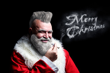Portrait of smoking brutal Santa Claus with the text "Merry Christmas" made of smoke. Unusual crazy Christmas. Santa in the form of a harsh punk