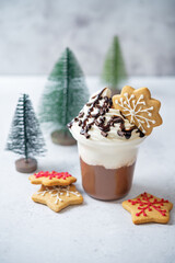 Chocolate cocktail or dessert with whipped cream with christmas cookies for Christmas