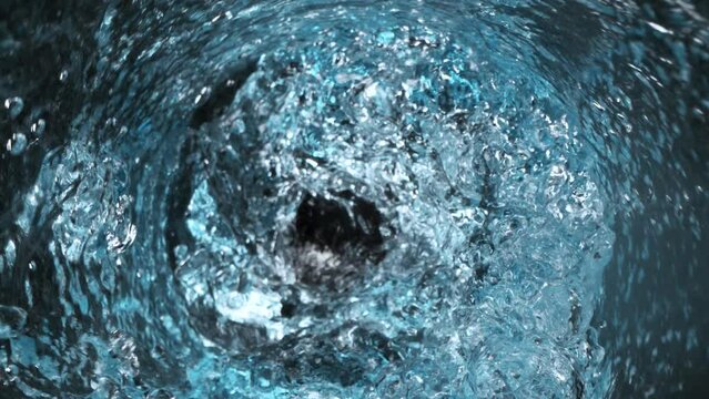 Super Slow Motion Shot of Water Vortex Splash on Black Background at 1000fps.