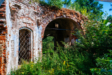 Fototapeta na wymiar Old abandoned overgrown ruins of church