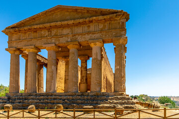 Obraz premium Agrigento, Sicily, Italy - July 12, 2020: Greek ruins of Concordia Temple in the Valley of Temples near Agrigento in Sicily