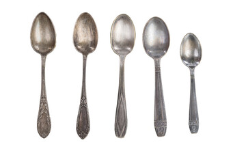 several antique silver spoons