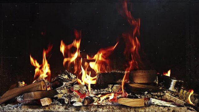Pile Of Firewood Burning is a stock video that features amazing footage of woods burning in fireplace in slow motion.