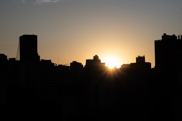 Fototapeta na wymiar Sunset sky with dramatic buildings silhouette in the historic center of São Paulo, Brazil - Pôr do sol com dramática silhueta de prédios no centro