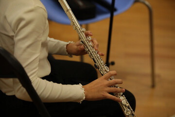 Naklejka premium A girl playing the flute