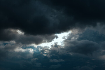 Fototapeta na wymiar Black clouds with light beam
