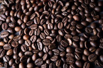 Coffee beans fill the frame background. Suitable for advertising background