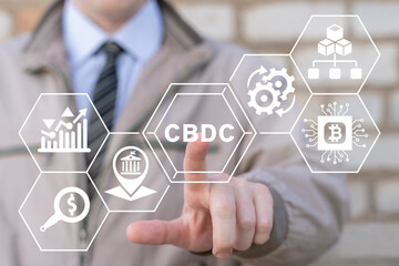Businessman using virtual touchscreen presses abbreviation: CBDC. Concept of CBDC - Central Bank Digital Currency. Business technology, financial, blockchain, exchange, smart money and digital asset. - obrazy, fototapety, plakaty