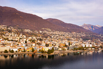 Fototapeta na wymiar Residential buildings of Locarno along shore of Lake Maggiore in Ticino canton, Switzerland.
