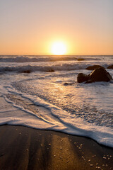 Sunset on the beach at False Klamath Cove in california