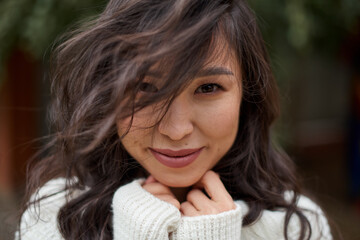 Beautiful asian kazakh brunette woman with flying long hair