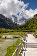 Vertical image of the wooden walkway in Yading national level reserve, Daocheng, Sichuan Province, China.