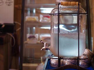 Cold water container for drinking. Drinking water Tank in a coffee shop.