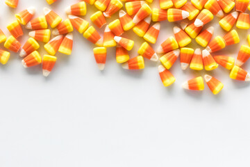 Candy corn forming a border at the top of the frame with copy space below.