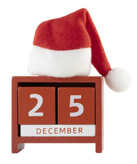 Cutout of an isolated Santa Claus Christmas hat on a red wooden desk calendar showing 25 December...