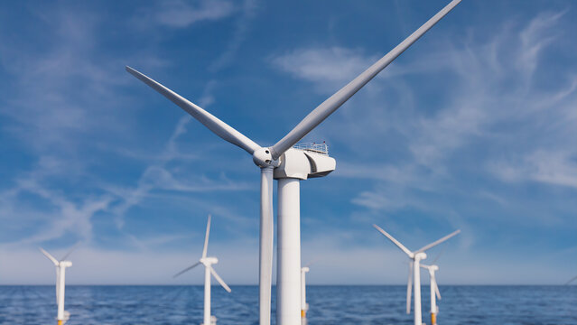 Wind Power. Offshore Wind Turbines on a Hazy Morning. Clean Electricity Concept.
