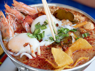 Tom Yum Kung Noodles in a hot pot ready to eat