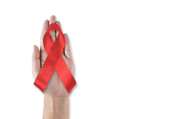 World aids day and national HIV AIDS and ageing awareness month with red ribbon on helping hand