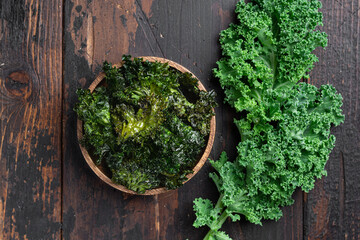 Dried kale chips, vegan food, background, top view - obrazy, fototapety, plakaty