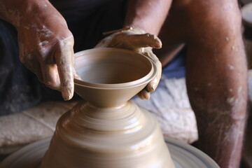 9 October 2022, Pune, India, Indian potter making Diya (oil lamps) or earthen lamps for Diwali Festival with clay, Handwork craft.