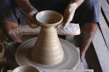 9 October 2022, Pune, India, Indian potter making Diya (oil lamps) or earthen lamps for Diwali Festival with clay, Handwork craft.