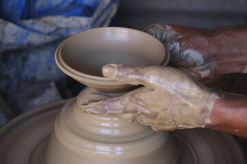 9 October 2022, Pune, India, Indian potter making Diya (oil lamps) or earthen lamps for Diwali Festival with clay, Handwork craft.