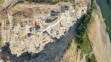 Archaeological site with the remains of a rock-cut settlement dating back to the Iron Age.