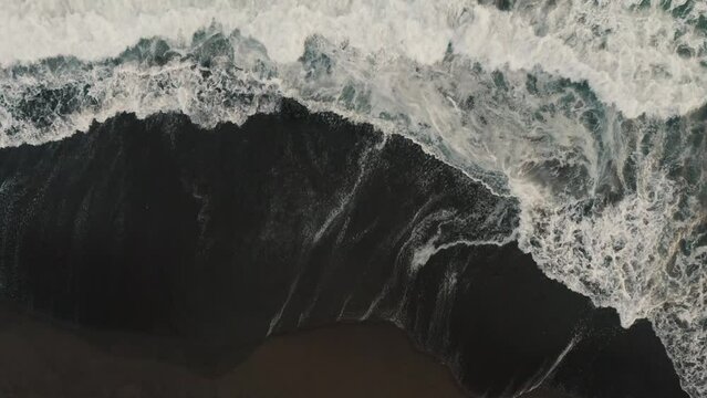 Overhead View Of Rough Foamy Waves Against Black Sandy Shore In El Paredon, Escuintla, Guatemala. Aerial Drone Shot
