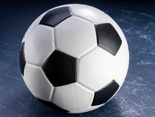 Fototapeta premium Football ball or background sports equipment on dark wooden background. 