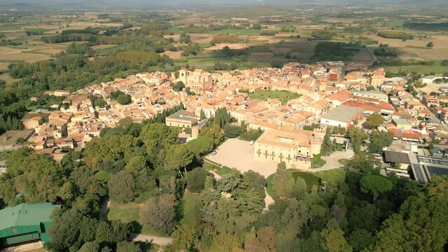 Aerial image of the city of Peralada in Girona Costa Brava small medieval town walking away from the city