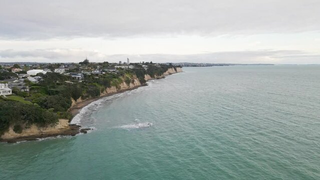 Aerial flight along the beautiful coast of Narrow Neck, New Zealand