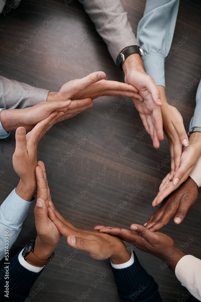 Aufkleber hands, teamwork and synergy with business people in a circle or huddle as a team on a wooden table i