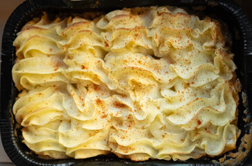 Shepherd's pie. Minced meat, mashed potatoes and vegetables casserole in cast iron pan. Top view