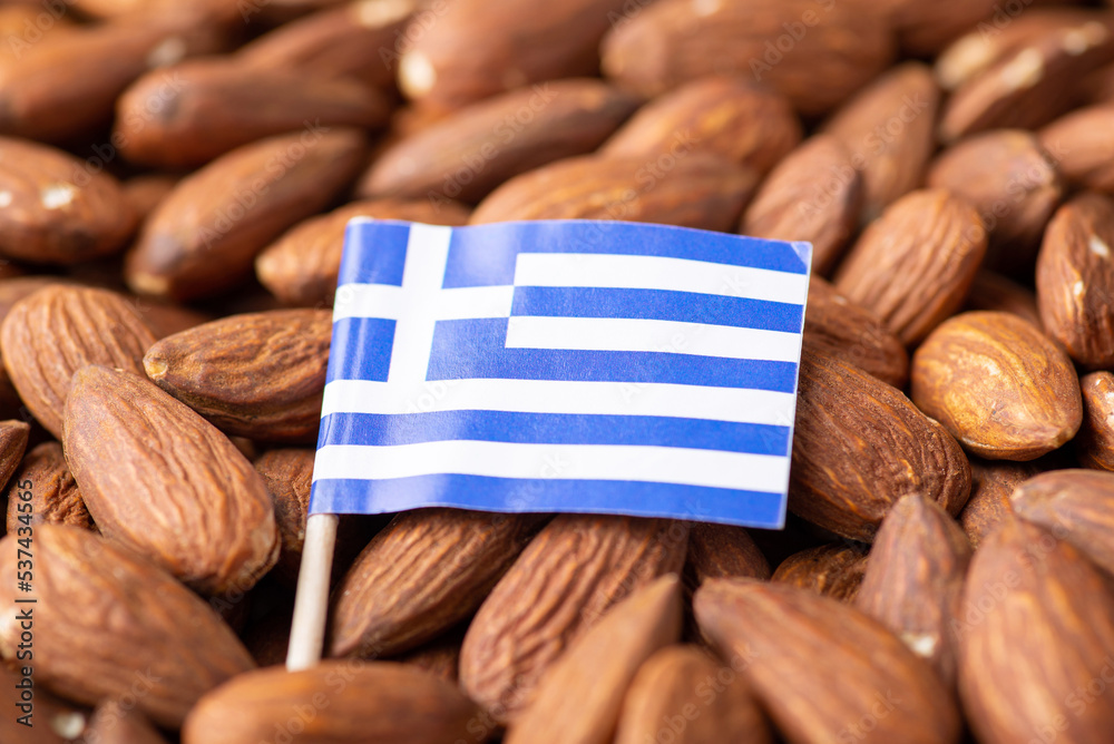 Poster Flag of Greece on almonds. Origin of nuts, agribusiness of growing almond nuts in Greece