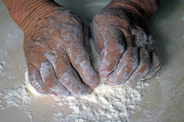 Senior man making bread